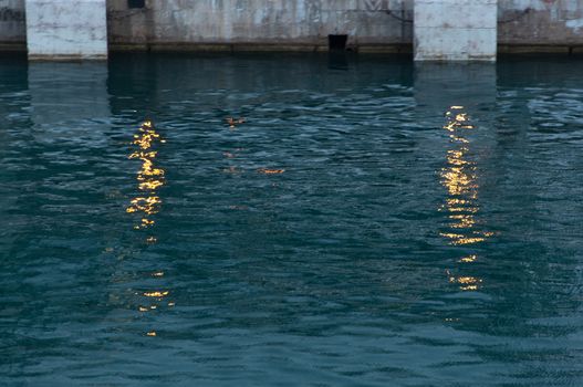 Light reflections in the harbor. Majorca, Balearic islands, Spain at daybreak.