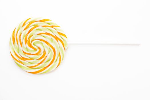 Big colorful round lollipop isolated on white background.