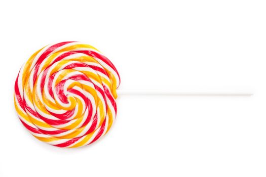 Big colorful round lollipop isolated on white background. Delicious sweets.