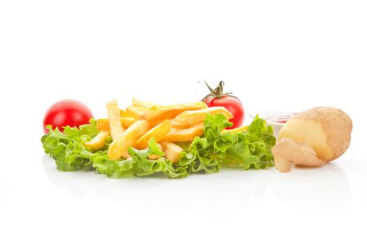 French fries with fresh salad, tomatoes, potatoes and ketchup. Culinary vegetarian eating.