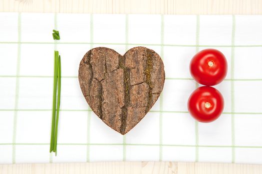 I love vegetable. Text and heart symbol made from organic vegetable and wood. Healthy natural concept.