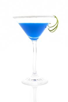 Delicious blue creamy cocktail in cocktail glass isolated on white background. Decorated with lime garnish.