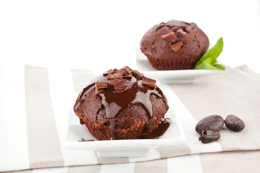 Delicious chocolate muffins with chocolate garnish.