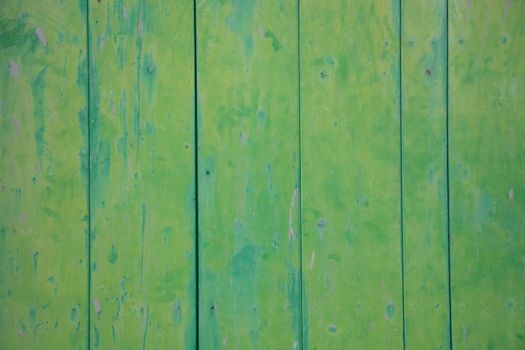 Green vintage painted and grungy wood wall.