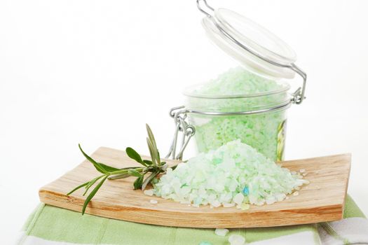 Bath salt on wooden tray and glass container with fresh lavender isolated on white. Beauty background.