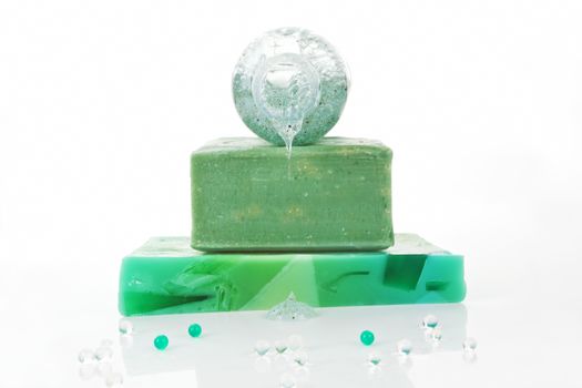 Wellness background. Organic soap bars and shower gel isolated on white background.