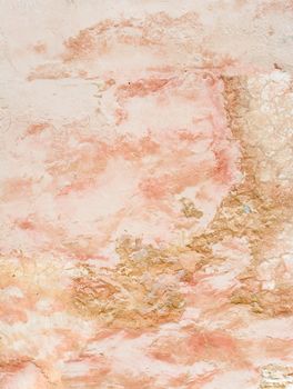 Wall background in earthy pinks and yellows.