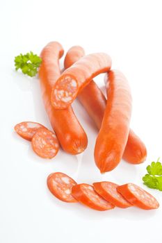 Delicious sausages isolated on white background. Unhealthy eating.