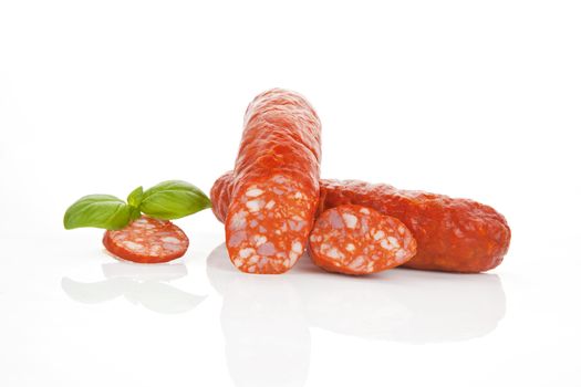 Delicious sausage isolated on white with fresh herb.