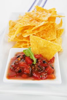 Delicious nachos baked with cheese and tasty homemade tomato sauce.