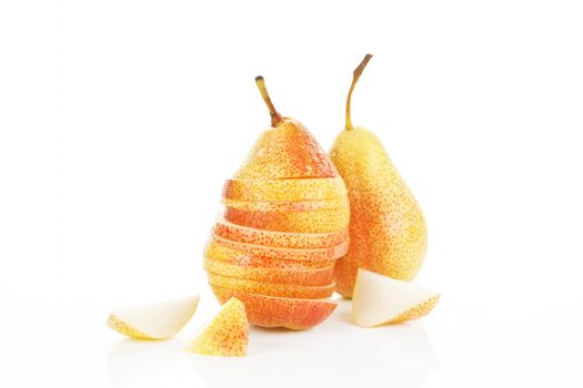 Ripe pear background. Slices, pieces and whole pears isolated on white.