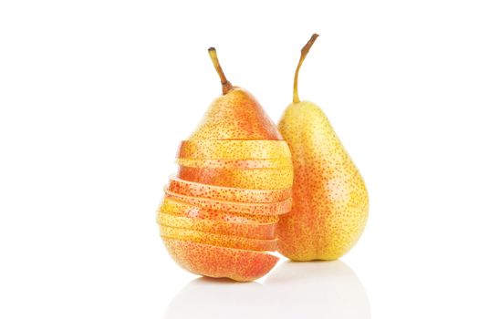 Fresh ripe pears in slices and whole piece isolated on white background.
