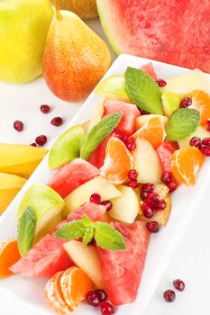 Colorful fruit salad. Apple, pear, banana, tangerine, pear and pomegranate fruit salad. Fresh summer eating. Hear your heart.  Heart your health.  ~Faith Seehill