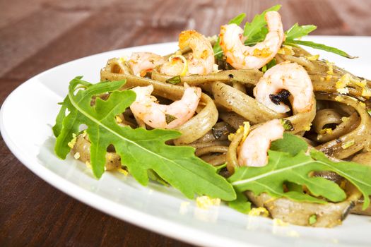 Delicious seafood pasta. Tagliatelle pasta with shrimps and fresh herbs.