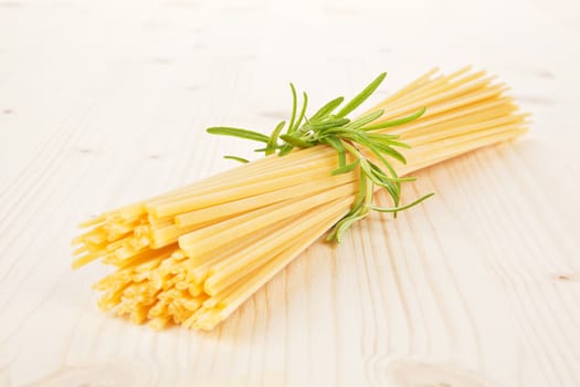 Traditional italian pasta. Spaghetti on wooden table.