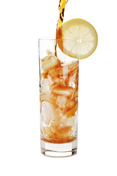Pouring cola into a glass with ice isolated on white background.