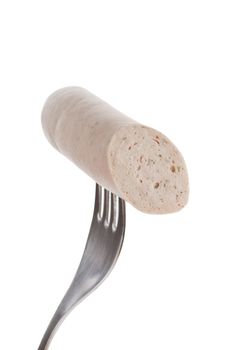 White bratwurst sausage on fork isolated on white background. Bbq concept.