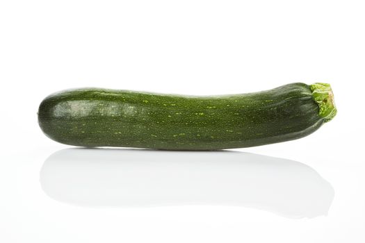 Green ripe zucchini isolated on white background.