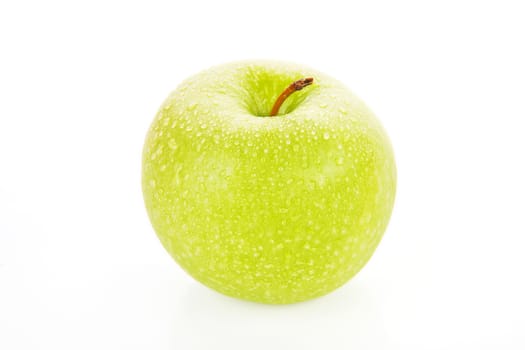 Green apple with water drops isolated on white background.