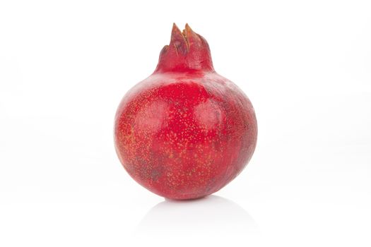 Ripe pomegranate fruit isolated on white background.