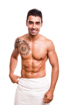 Attractive man posing with a white towel