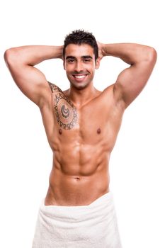 Attractive man posing with a white towel