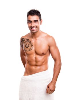 Attractive man posing with a white towel