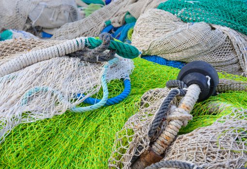 Fishing net and gear in green and blue colors.