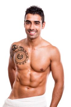 Attractive man posing with a white towel