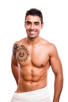 Attractive man posing with a white towel