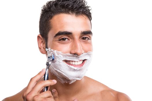 Man shaving his face over white background