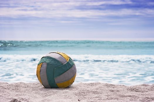 Summer beach background. Volleyball ball on empty beautiful beach.
