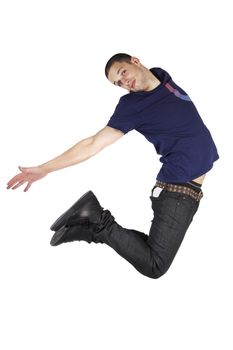 Young man in stylish casual clothing jumping in the air isolated on white background.