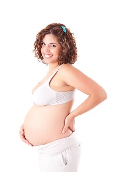 Beautiful pregnant woman showing her good shape over white background