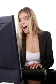 Pretty blond office secretary lady with shocked expression looking at her screen