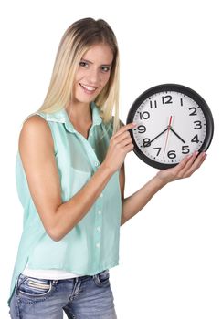 Young woman poiting to the time on a clock concept