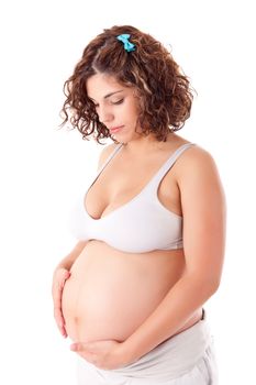 Beautiful pregnant woman showing her good shape over white background