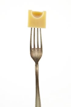 Emmental piece on fork isolated on white background. 