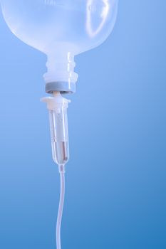 Infusion bottle with saline solution for patient in hospital room