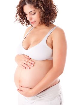 Beautiful pregnant woman showing her good shape over white background