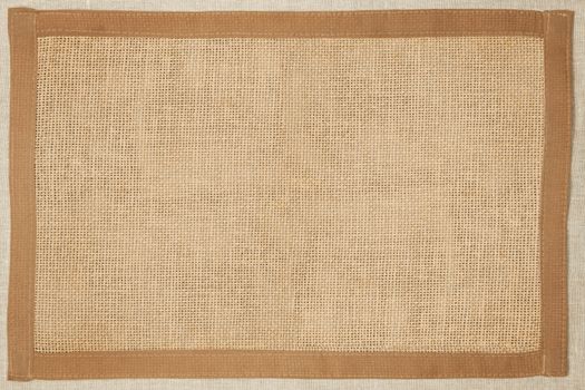 Brown natural textured fabric background with natural frame.