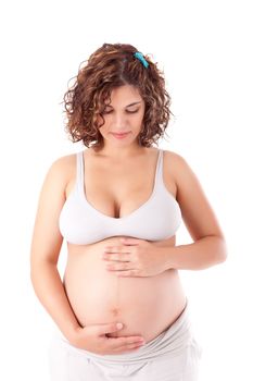 Beautiful pregnant woman showing her good shape over white background