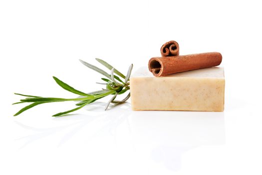 Cinnamon and cinnamon soap bar with fresh lavender isolated on white.