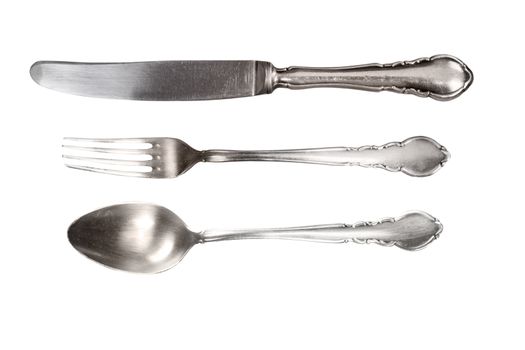 Silver antique cutlery isolated on white background.