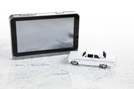 Portable GPS navigation with white muscle car and map.