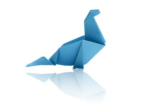 Blue origami dinosaur isolated on white background.