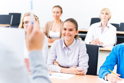 image of a students listen attentively to the teacher