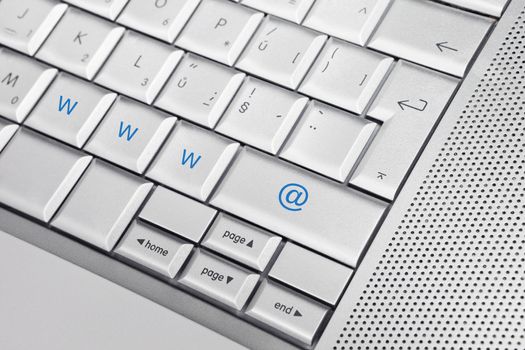 Silver keyboard with www and @ keys. Internet concept.