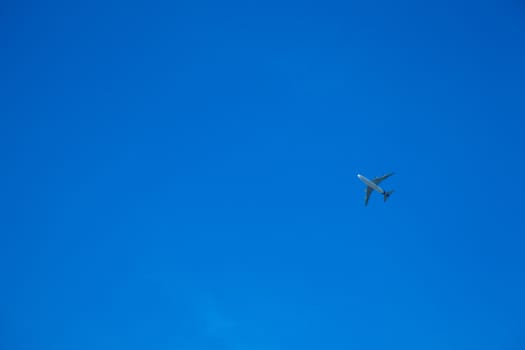 Aircraft flying in the sky. In order to land in the airport. Dark sky bright.