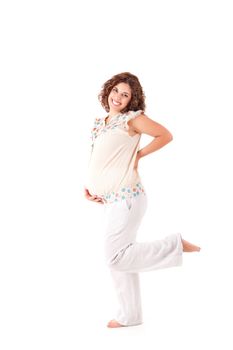 Beautiful pregnant woman showing her good shape over white background